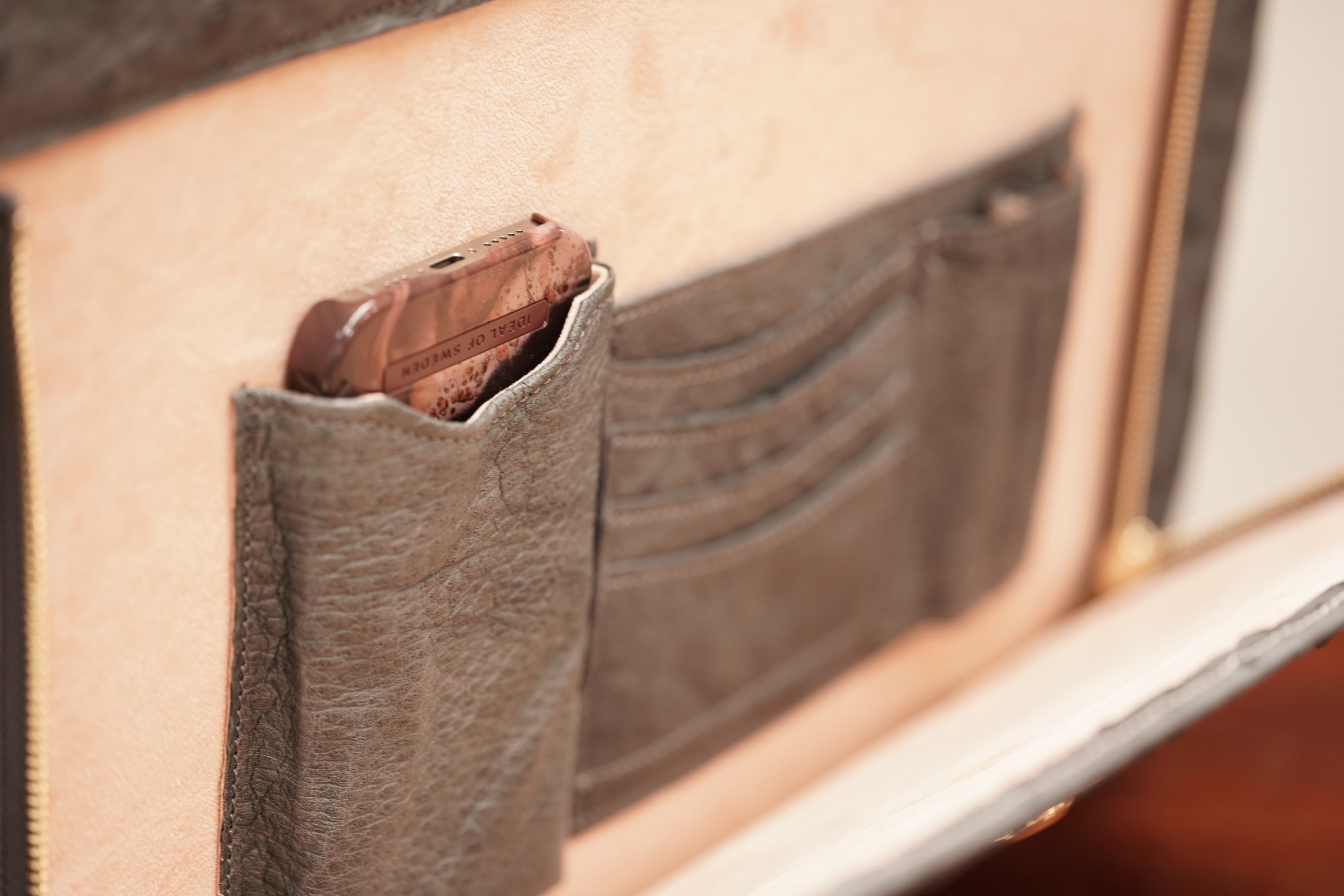 Warm greystone A4+ business bag in ostrich leather