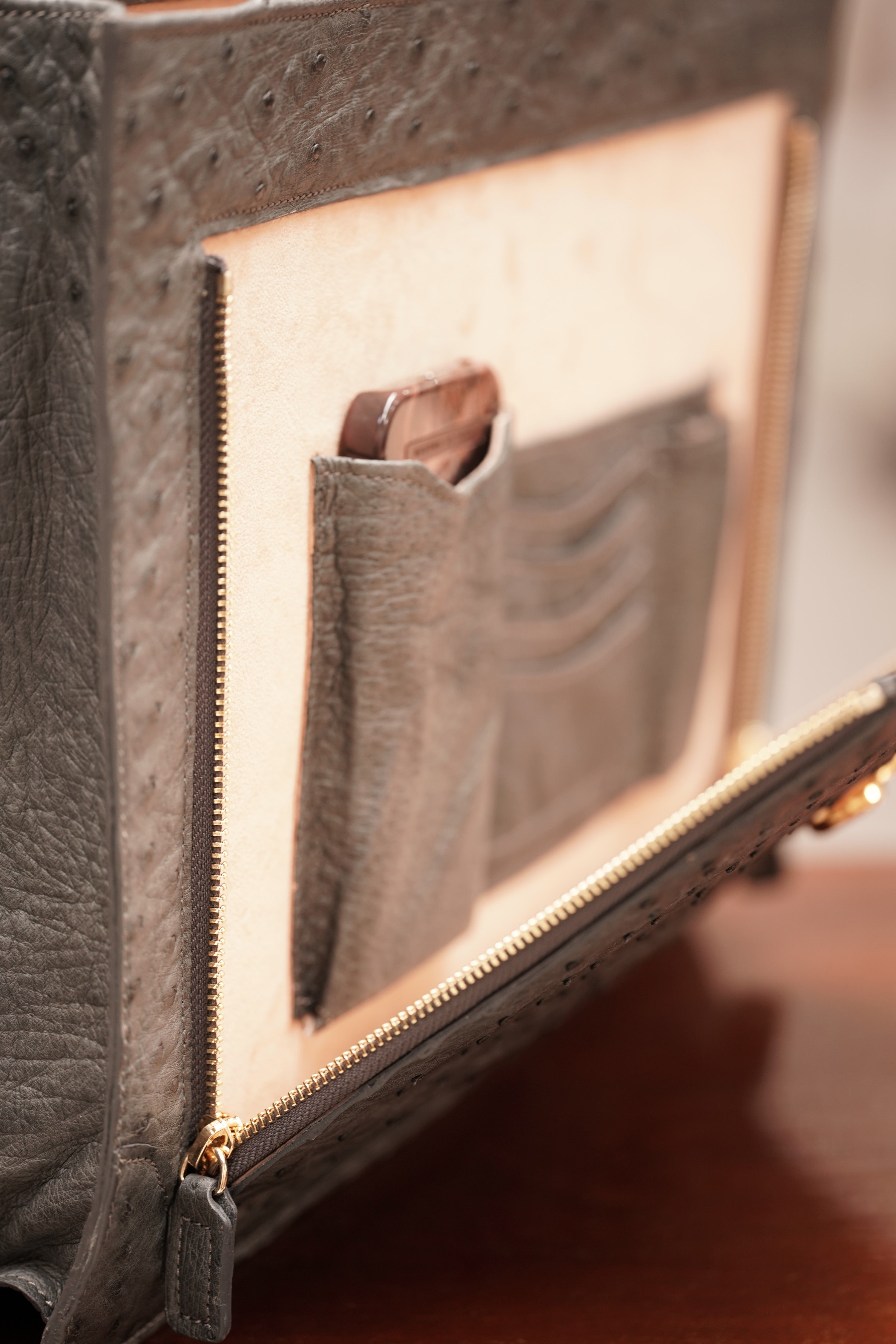 Warm greystone A4+ business bag in ostrich leather