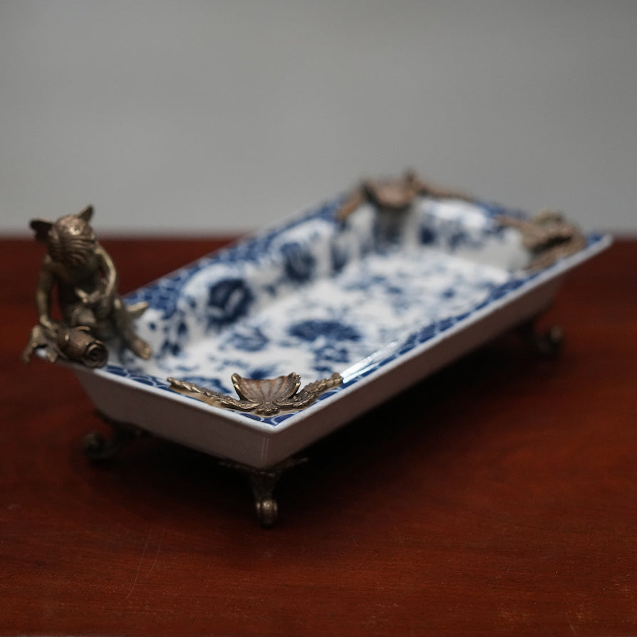 Classical porcelain ashtray with bronze feet and decoration