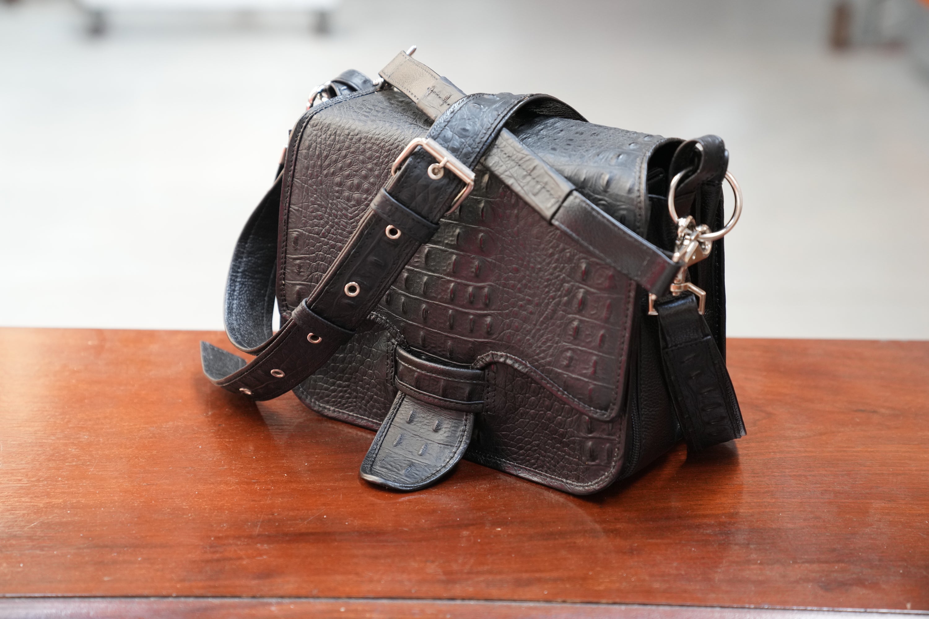 Black Cigarriel in crocodile stamped leather