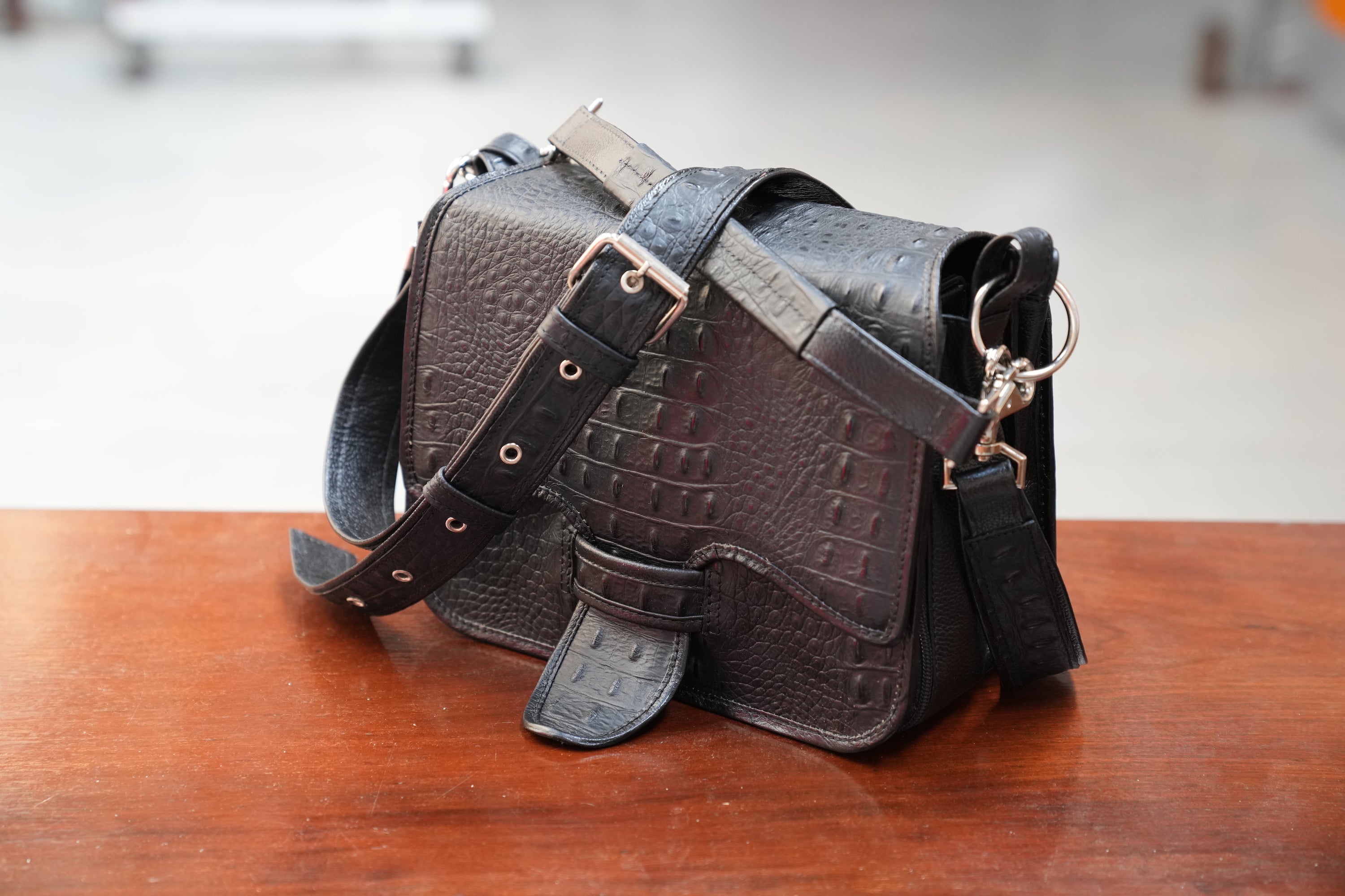Black Cigarriel in crocodile stamped leather
