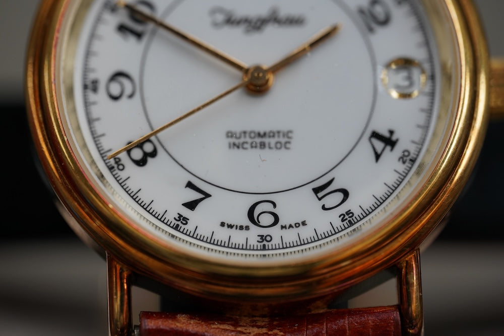 Guilded Junfrau microrotor automatic, date