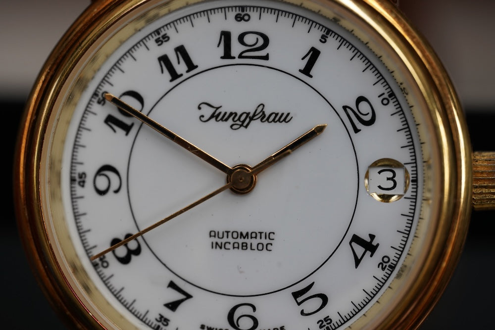 Guilded Junfrau microrotor automatic, date