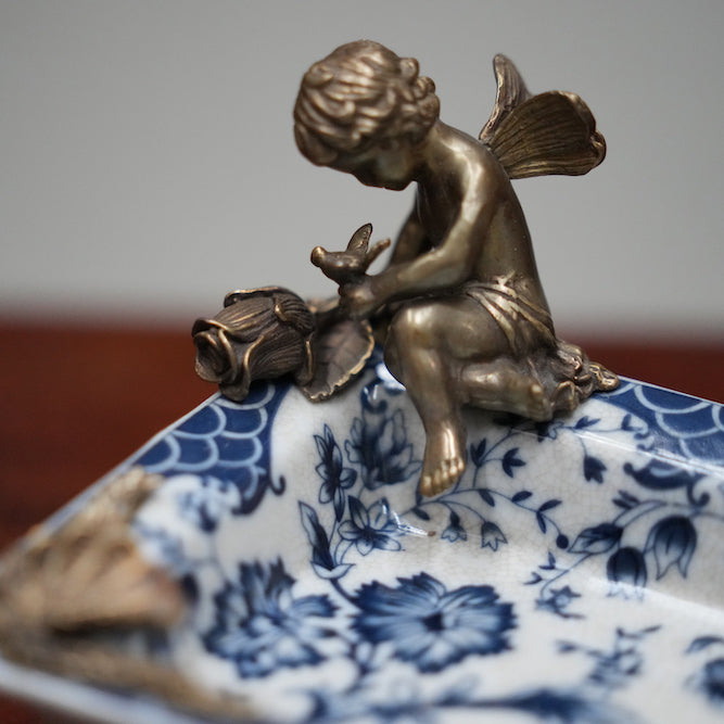 Classical porcelain ashtray with bronze feet and decoration